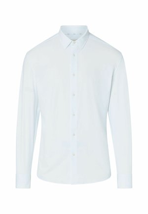 Camisa blanca de manga larga con botones, cuello puntiagudo y puños abotonados, mostrada sobre un fondo liso.