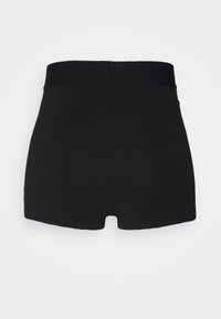 Black high-waisted shorts made of stretchy fabric with a smooth texture. The design features a simple, minimalistic style with no embellishments.