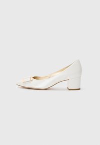 White leather pump with a pointed toe, small block heel, and a decorative gold and white accent on the vamp. Smooth texture throughout.