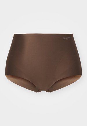 Bruine hoge taille slips gemaakt van gladde, rekbare stof, met het Calvin Klein-logo op de tailleband en naadloze randen voor comfort.