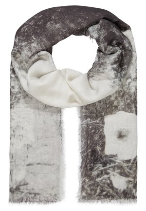 Écharpe douce avec des motifs abstraits et floraux noirs, blancs et gris, pliée légèrement avec des bords frangés.