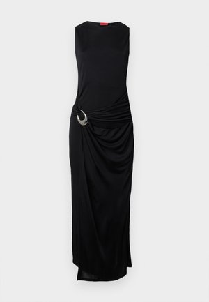 Black sleeveless dress with a draped design and silver ring accent at the waist. Smooth fabric with a slight sheen and a floor-length hem.