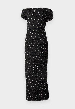 Off-the-shoulder black dress with cream polka dots, featuring ruched detailing and a fitted silhouette, reaching below the knee.