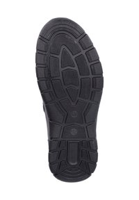 Semelle de chaussure en caoutchouc noir avec un motif de bande de roulement texturé, présentant de profondes rainures et des sections surélevées pour une traction et une adhérence améliorées. Zone des orteils renforcée.