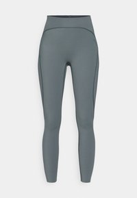 Magas derékú leggings, tompa szürke színben, rugalmas, nedvességet szívó anyagból készült, lapos varrásokkal és sima felülettel.