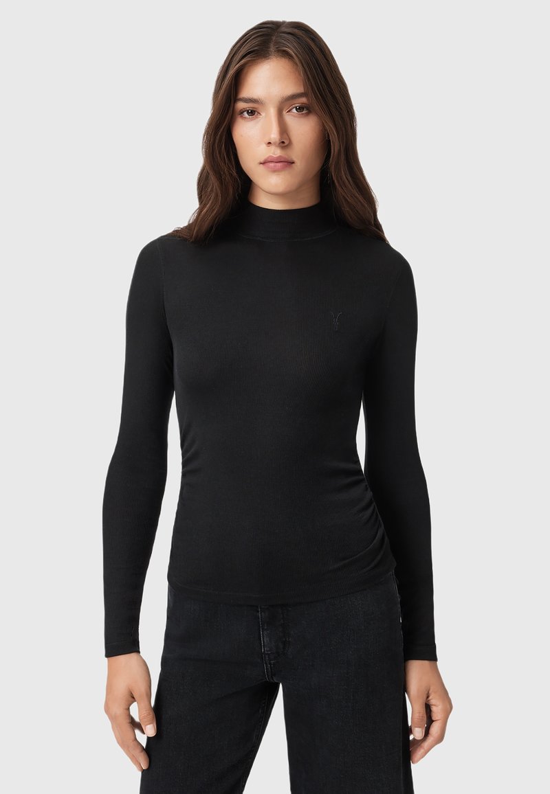Maglione aderente nero a maniche lunghe con collo a roulè, caratterizzato da un design fitted e un discreto logo sulla parte sinistra del petto. Realizzato in materiale morbido ed elastico.