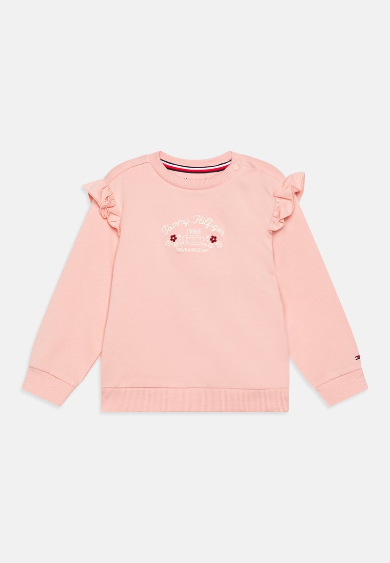 Rózsaszín pulóver fodros ujjal, kerek nyakkivágással és hímzett logóval. Bordás mandzsettákkal és szegéllyel rendelkezik, puha anyagból készült.