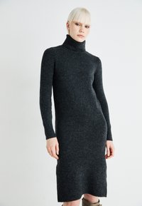 Dark grey, long-sleeve turtleneck dress made of soft wool blend. Slim fit with ribbed cuffs and hem, featuring a smooth texture.