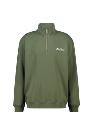 Green pullover sweatshirt with a half-zip collar, ribbed cuffs, and hem, featuring white "New York" text on the left chest. Soft material.