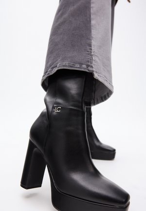 LOLA CASADEMUNT Platform ankle boots - black