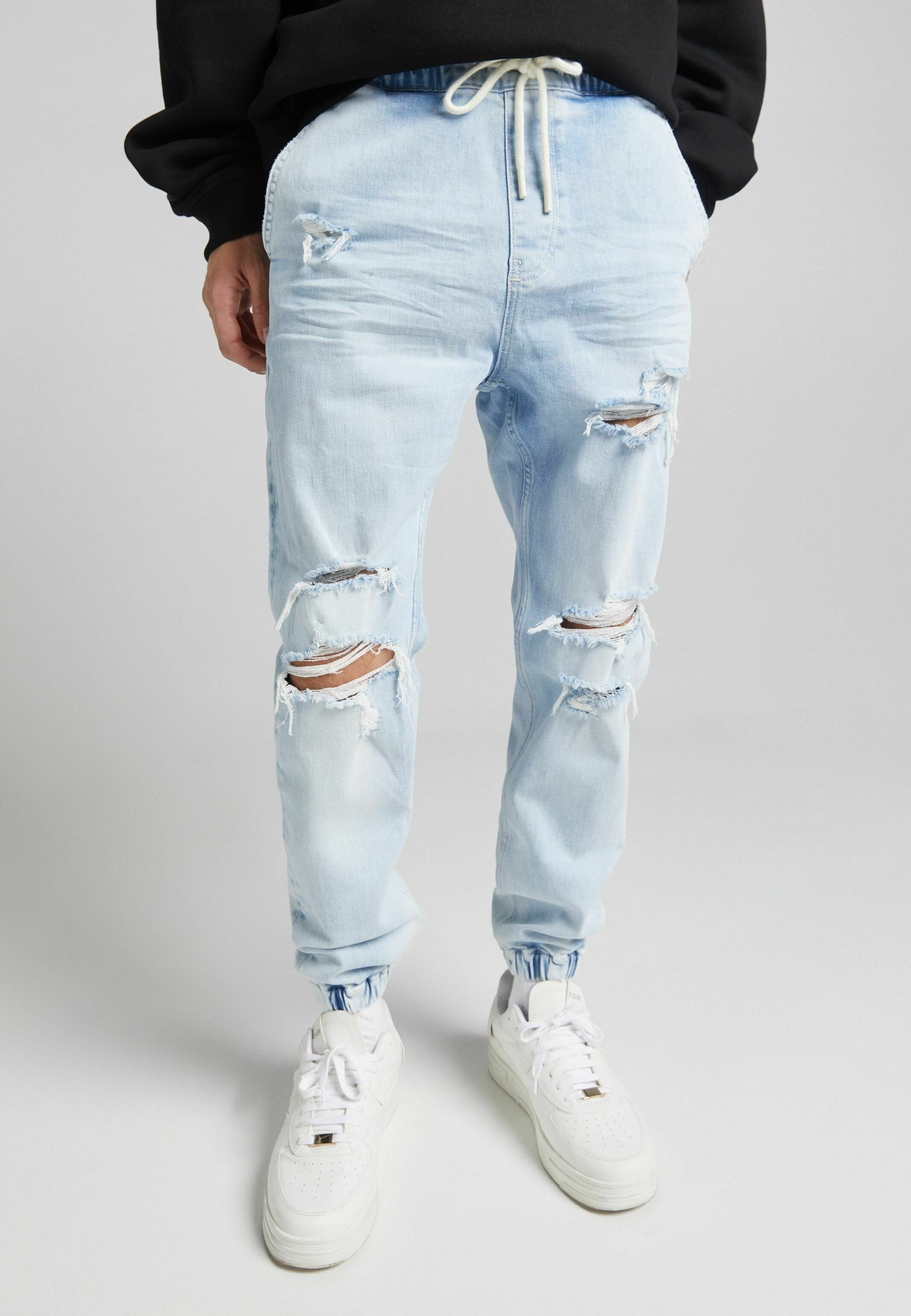 Bershka MIT ZIERRISSEN - Jeans Tapered Fit - light blue - Zalando.de