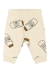Hellbeige Kinderhose mit elastischem Bund, mit einem Muster von Milchkartons, die in Schwarz umrandet sind und braune Deckel haben.