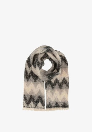 Écharpe en laine avec un motif zigzag gris et crème et des franges aux extrémités. Texture douce, enroulée pour un drapé facile.