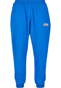 Blue athletic pants made of lightweight material, featuring an elastic waistband, side pockets, and elastic cuffs at the ankles.