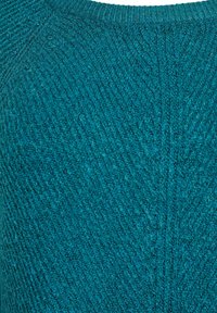 Teal knitted pullover with a textured finish, featuring a crew neckline and diagonal pattern across the fabric. Soft, warm material.