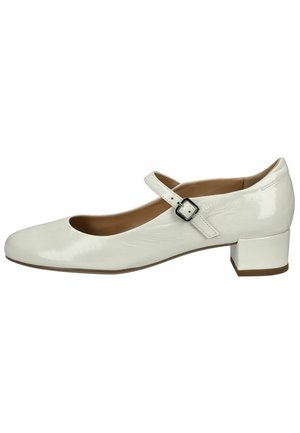 White patent leather Mary Jane shoe with a rounded toe, flat square heel, and an adjustable strap featuring a silver buckle detail.
