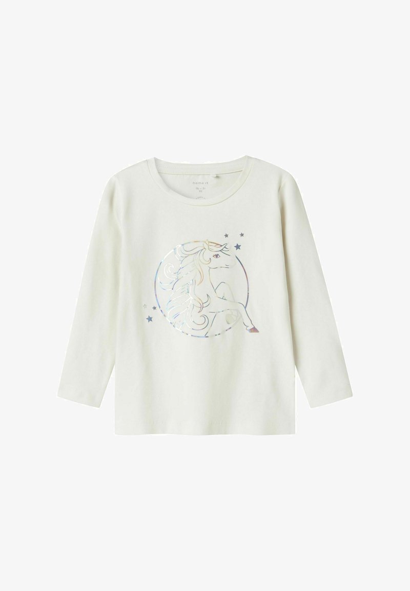Camisa de algodón blanca de manga larga con un gráfico de unicornio holográfico en un diseño circular, acentuado por pequeñas estrellas.
