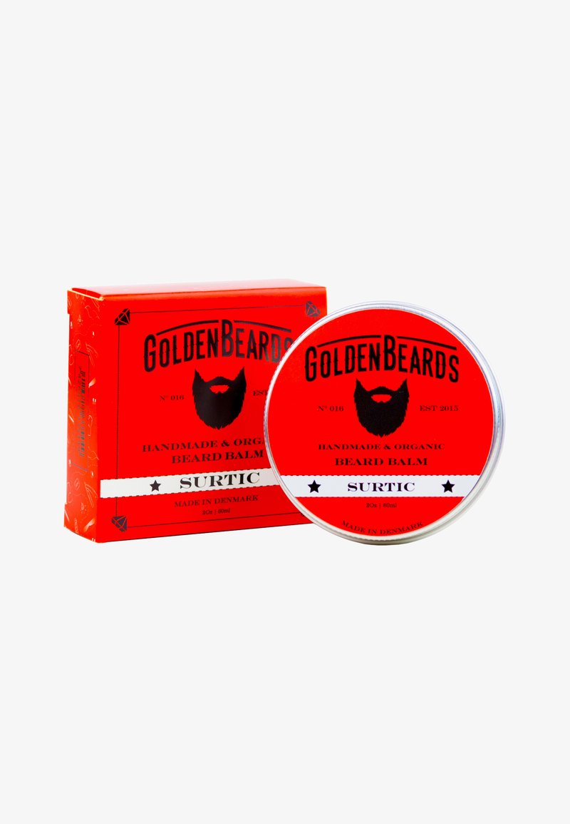 Okrągła metalowa puszka z balsamem do brody w kolorze czerwonym, z etykietą z czarnym tekstem, umieszczona obok pasującego czerwonego pudełka, obie wyposażone w grafikę brody oraz szczegóły.