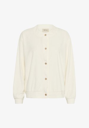 Kreemikardigan pehmest kangast, millel on krae, ees nööbid ja soonikust varrukad. Lihtne ja kerge disain.