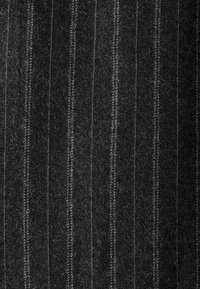 Woven fabric, dark gray with subtle vertical stripes. Soft texture with a fuzzy appearance; stitching visible along the stripes.