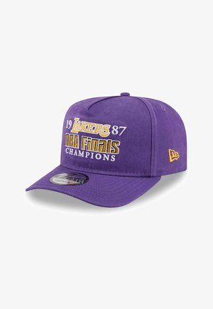 Purple snapback cap with "1987 Lakers NBA Finals Champions" embroidered in yellow and white on front, New Era logo on side.
