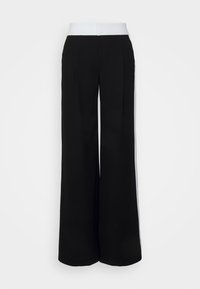 Svart vida byxor med ett kontrasterande vitt midjeband, med en mjuk textur och två framfickor för mer struktur.