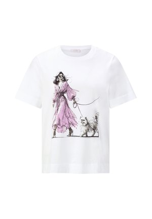 Woman in a flowing pink dress and sunglasses walking a fluffy small dog on a leash, printed on a white short-sleeve T-shirt.