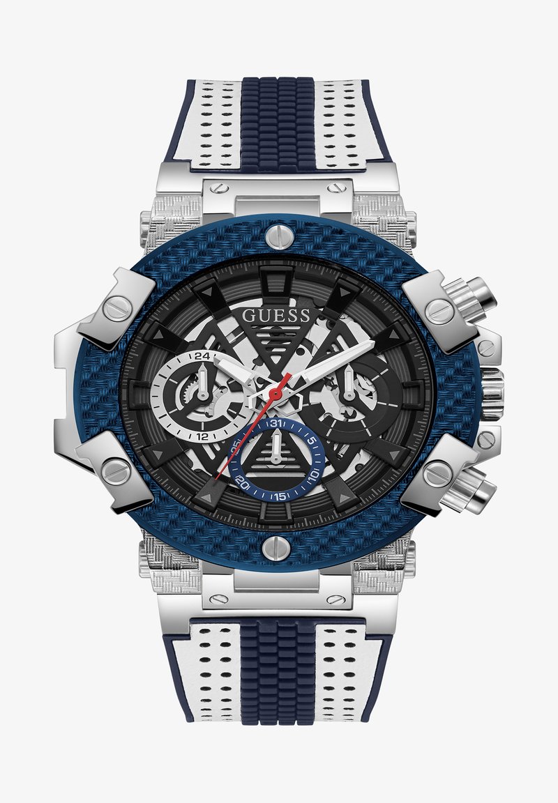 Guess Chronograph-Uhr mit einer blauen strukturierten Lünette, schwarzem Zifferblatt, silbernen Akzenten und einem zweifarbigen Gummiarmband mit weißen und marineblauen Designs.