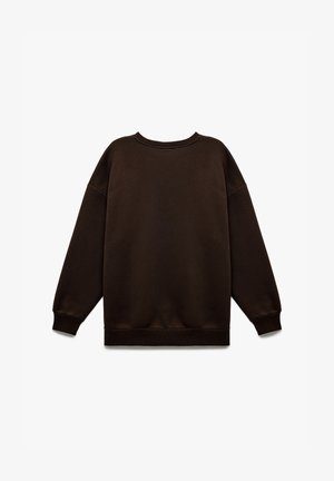 Brązowa bluza z luźnym krojem, okrągłym dekoltem oraz ściągaczami przy mankietach i u dołu. Wykonana z miękkiego materiału, nie posiada widocznych logo ani wzorów.