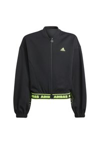 Giacca Adidas cropped nera con zip frontale, polsini elasticizzati e logo Adidas verde neon sul petto e sull'orlo. Texture del tessuto liscia.