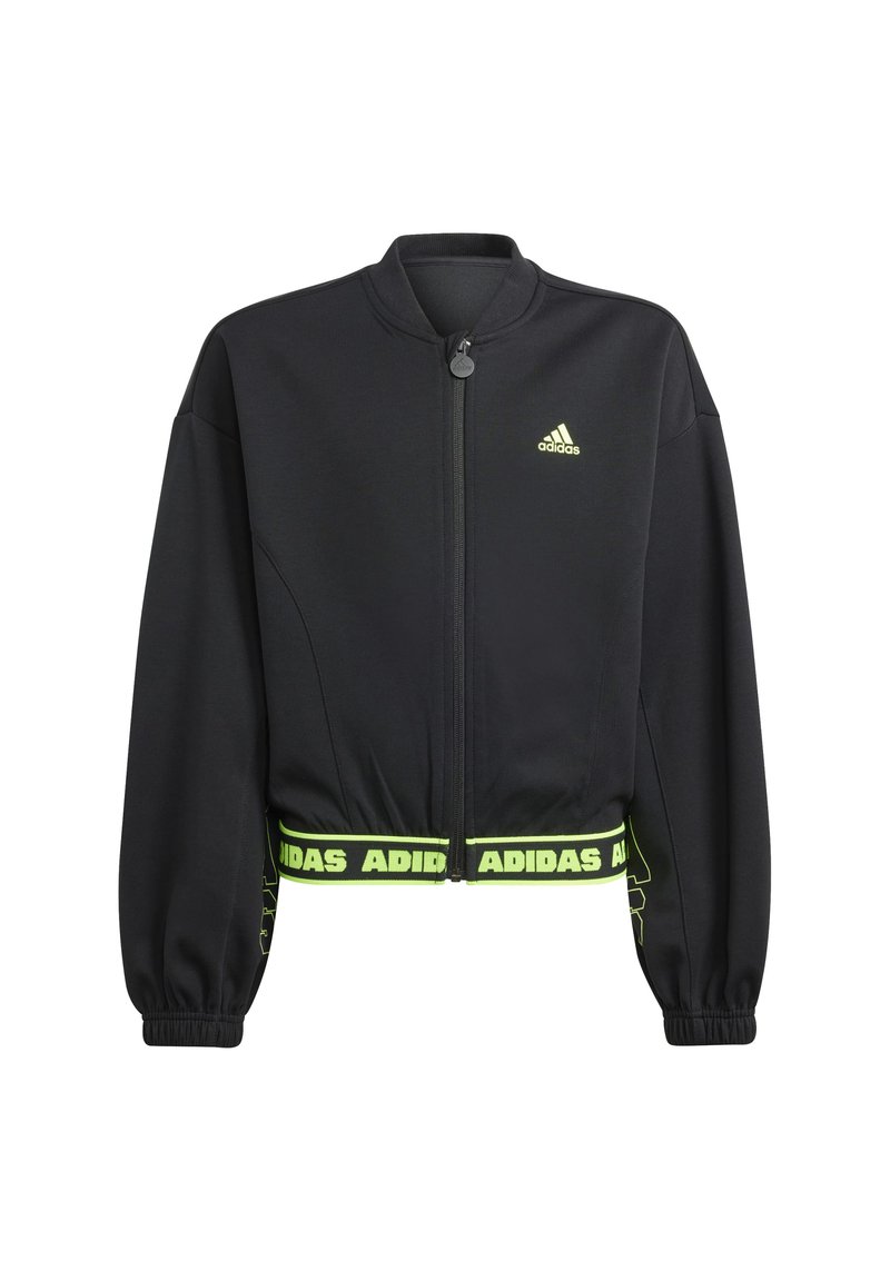 Giacca Adidas cropped nera con zip frontale, polsini elasticizzati e logo Adidas verde neon sul petto e sull'orlo. Texture del tessuto liscia.