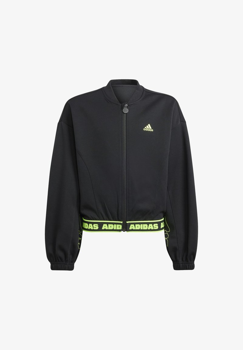 Giacca Adidas cropped nera con zip frontale, polsini elasticizzati e logo Adidas verde neon sul petto e sull'orlo. Texture del tessuto liscia.