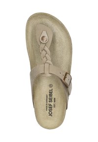 Sandal beige in suede, con cinturino intrecciato, accento circolare in bronzo e una soletta piatta con logo impressa. Chiusura con fibbia regolabile.