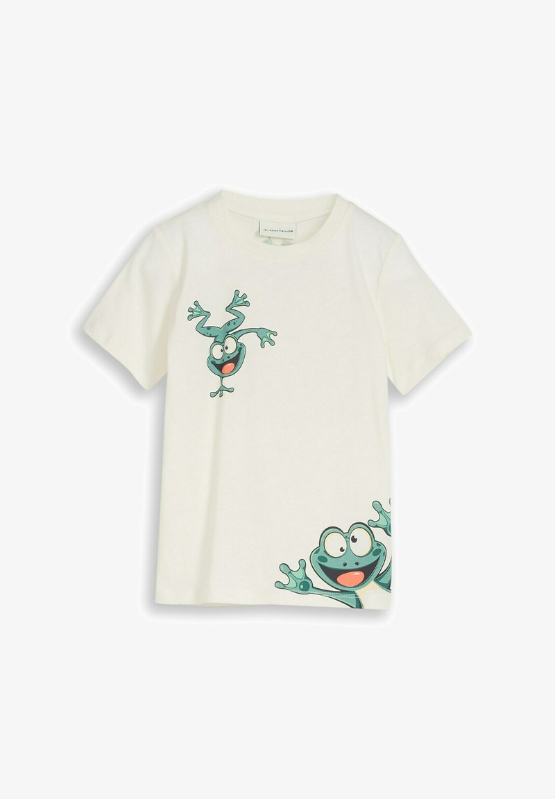 Camiseta blanca de manga corta con dos ranas verdes de dibujos animados juguetonas, una cerca del pecho y otra asomándose desde la esquina inferior derecha.