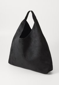 Soft black suede hobo handbag with a wide single strap and a slouchy, unstructured shape on a plain white background.