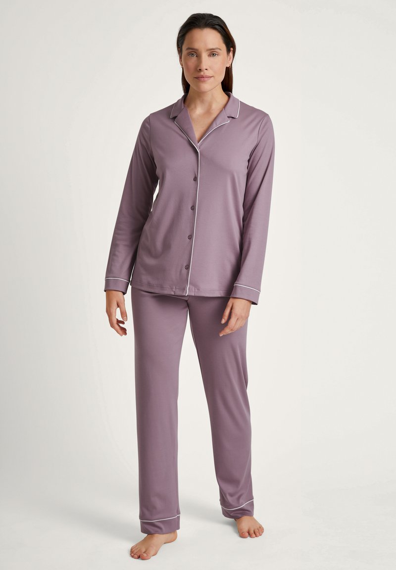 Lavender long-sleeve pajama set with contrasting white piping, featuring a button-up shirt and matching pants, made from soft fabric.
