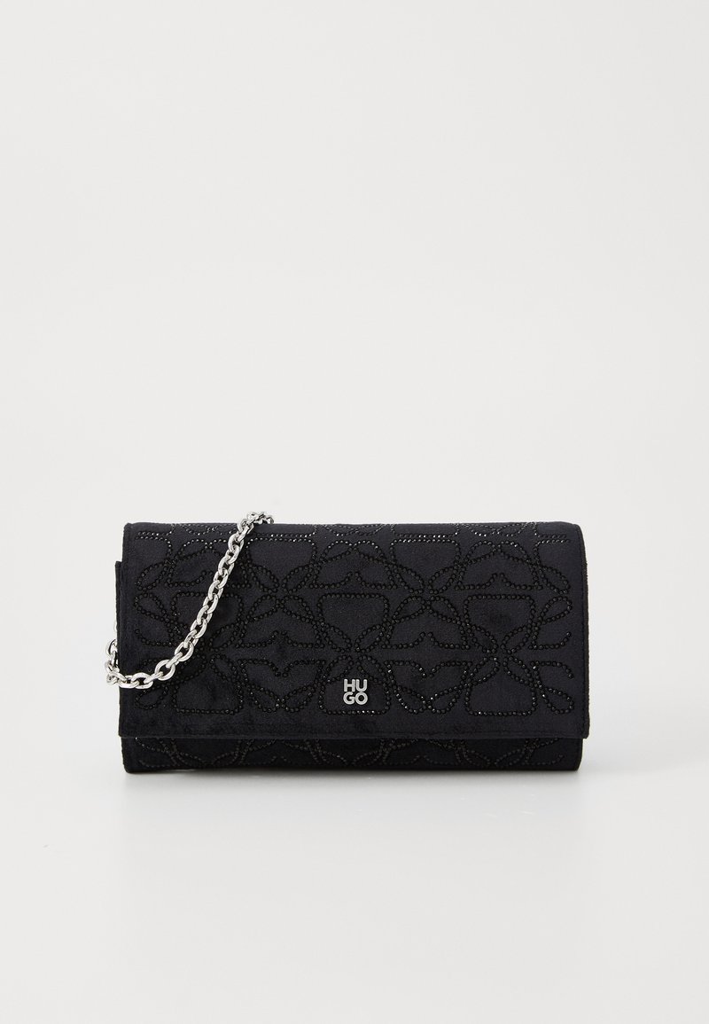Black suede wallet with a floral embossed design, silver chain strap, and subtle logo detail on the front. Clasp closure.
