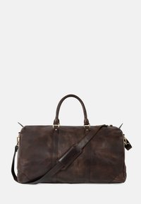 Braune Sporttasche aus Leder mit glatter Textur, doppelten Griffen, verstellbarem Schultergurt und goldfarbenen Hardware-Akzenten.