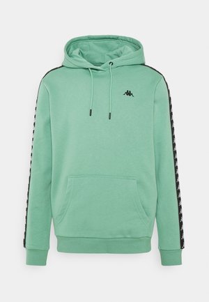 Hoodie vert menthe avec une pochette kangourou, un capuchon ajustable avec cordon, et des bandes latérales noires arborant un motif de logo répétitif.