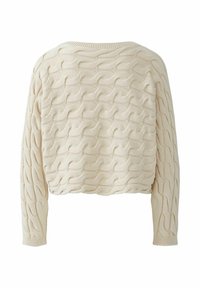 Beige gebreide crop sweater met een textuur golf patroon, ronde halslijn en lange mouwen. Heeft geribde manchetten en zoom.