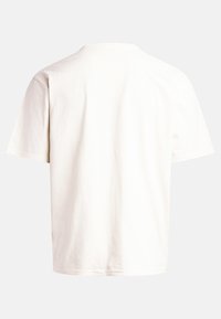 T-shirt en coton blanc, à manches courtes, col rond, coupe décontractée. Texture lisse sans motifs ni embellissements.
