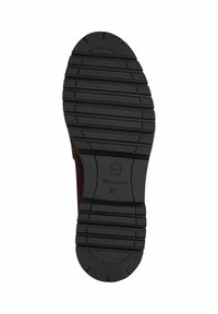 Black rubber sole with textured tread design, featuring raised horizontal and vertical lines. Brand logo and size printed on heel area.