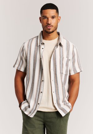 Kurzärmeliges Hemd mit Knöpfen in Beige mit vertikalen, mehrfarbigen Streifen. Verfügt über eine Brusttasche, entspannten Schnitt und abgerundeten Saum.