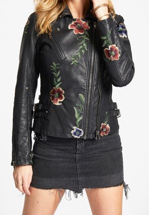 Jacka i konstläder - black