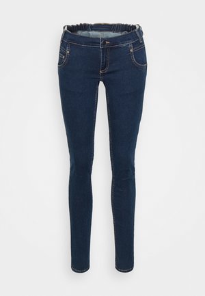 Mörkblå denimjeans med smal passform, elastisk midja, framsidor och kontrasterande sömnadsdetaljer. Slät textur med minimal slitage.