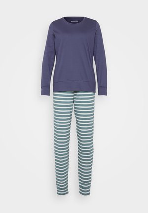 Haut à manches longues bleu marine associé à un pantalon rayé horizontal teal et blanc, présenté sur un fond clair uni.