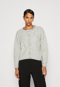 Gray, fuzzy cardigan with a round neck, long sleeves, and a row of six colorful buttons down the front. Textured material and relaxed fit.