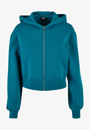 Türkis lõikega kapuutsiga dressipluus, mis on valmistatud pehmest kangast, ees luku ja suure kapuutsiga, ribatrepi mansettide ja äärtega, et tagada sobiv välimus.