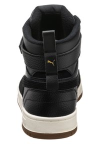 Black high-top sneaker with textured leather, padded collar, gold logo accent, and white rubber sole. Features adjustable straps for secure fit.