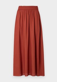 Jupe maxi terracotta avec une ceinture élastique, présentant un tissu froncé pour une silhouette fluide, confectionnée en coton léger.